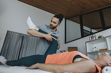 woman getting stretched by man